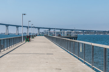 Cesar Chavez Park pier with Coronado Bridge in San Diego, California
