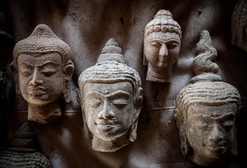 Closeup of the buddha face with light and shadow.