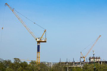 Fototapeta na wymiar crane building construction with clear sky, outdoor background