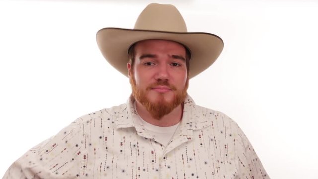 Hipster millennial cowboy showing handfull of poker chips