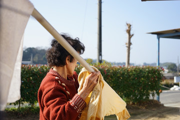 Fototapeta premium Senior person washing clothes with her hands