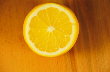 Half of the fresh lemon on wooden background