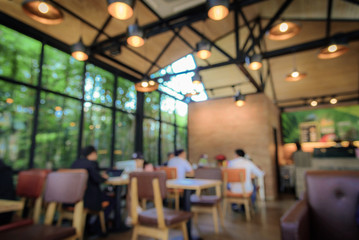 Blurred image coffee shop with abstract bokeh light background. Vintage tone
