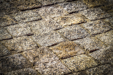 Old paving stone closeup as a background.