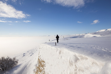 Man standing on old castle in snow