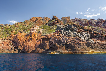 Fototapeta na wymiar Volcanic rocks of Scandola coastline