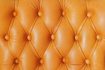 Buttoned on the brown texture from sofa