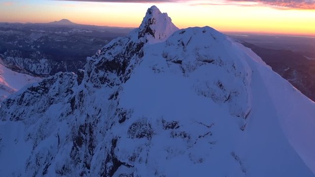 Unbelievable Helicopter View of Sunset Purple Orange Glowing Light Mt Rainier and Three Fingers Cascades Mountains Panorama. Incredible Lighting Conditions