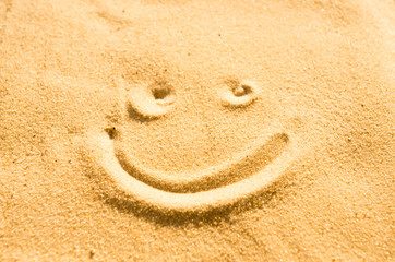 Fototapeta na wymiar Smile on the sand