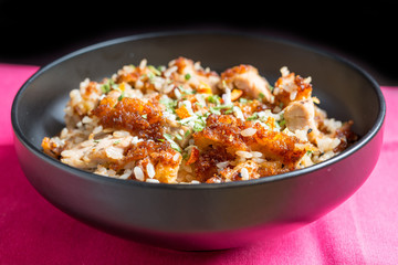 Homemade Chinese fried rice with vegetables and fried eggs