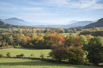 Obraz premium Beautiful Autumn Fall sunrise foggy landscape image over country