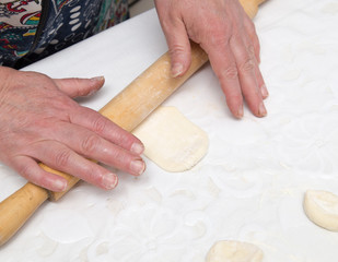 chef rolls the dough