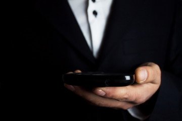 phone on businessman hand