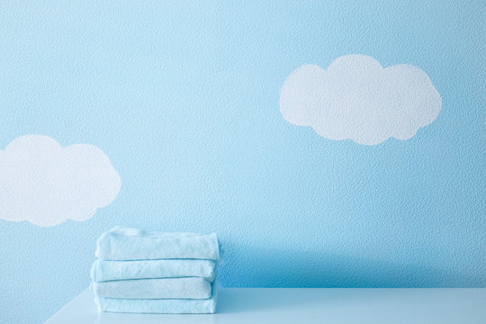 Blue washcloth on the table on blue sky background