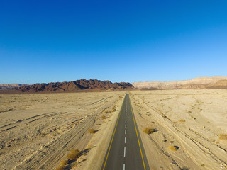 Empty desert road aerial view