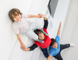 Cheerful funny children having fun and posing line up piggyback