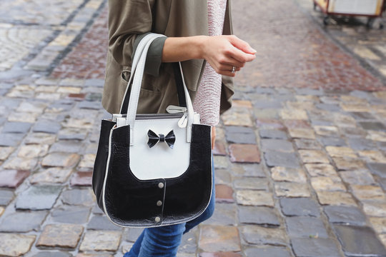 Stylish girl with beautiful leather handbag