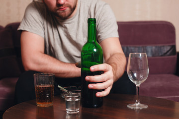 Anonymous alcoholic person hard drinking.