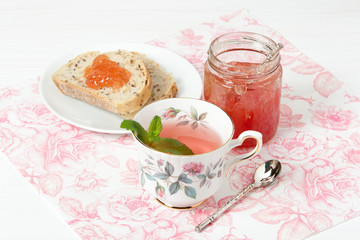 Watermelon Jam, Herbal Tea, Marshmallows. White Wooden Table