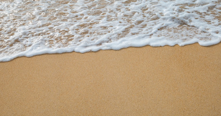 Bubbles waves on the beach texture background