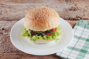 Tasty fresh Burger on the white plate