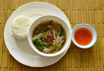 boiled pork blood and entrails soup eat couple with rice on dish