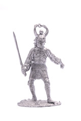 tin soldier medieval knight with sword isolated on white