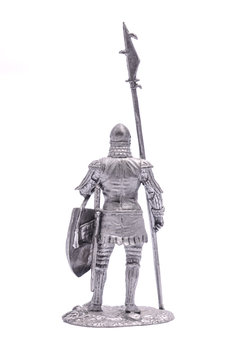 tin soldier medieval knight with spear and shield isolated on wh
