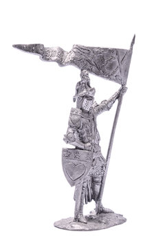 tin soldier medieval knight with sword and shield isolated on wh