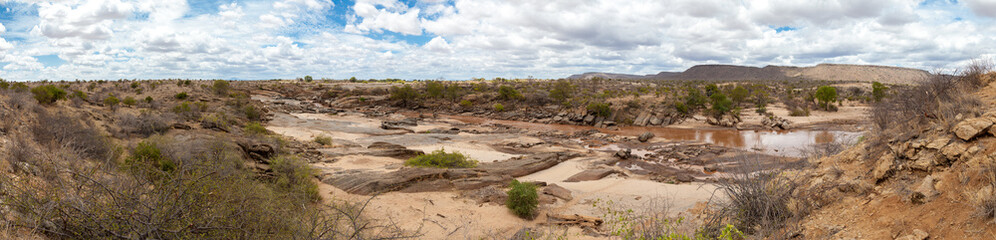 Panoramic view from landscape in Kenya with a river and blue sky
