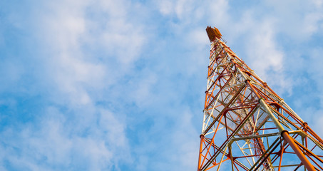 telecommunication tower with blue sky background.