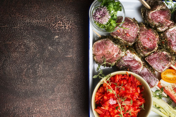 Raw Meat skewers preparation with fresh gut vegetables on rustic background,  top view, border