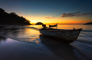 Small boat at the Andaman Sea  at sunset