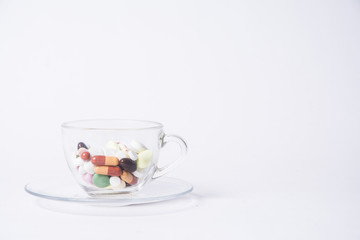 Obraz na płótnie Canvas coffy cup with pills