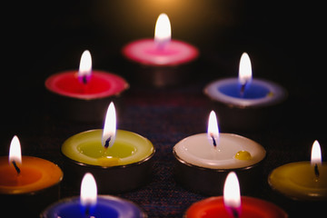 Selective focus of Candle flame light at night with night background.