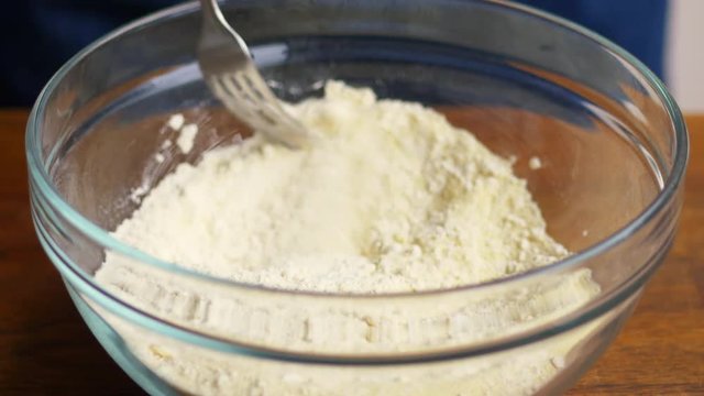 Cook Mixing Semolina And AP Flour To Make Pasta Dough