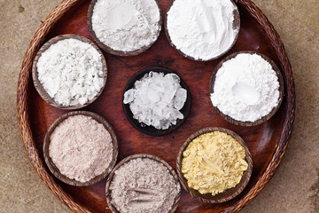 Sea Salt Different Grinding in Bowls on Light Background