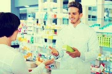 pharmacist helping customers