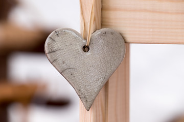 Stone heart shape on wood. Love symbol.