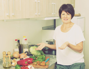 senior woman preparing salad