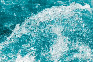 Fototapeta na wymiar background of stormy water with splashes