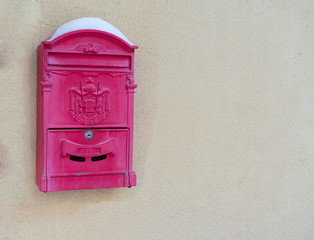 a one-time e-mail box on the wall red