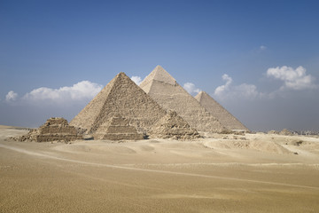 Panoramic view of pyramids from the Giza Plateau (three pyramids known as Queens' Pyramids on front...