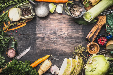Healthy vegetarian cooking ingredients for soup or stew. Raw organic vegetables with kitchen tools...