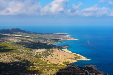 View from above to the Cyprus island sea coast with blue water and lagoons. Akamas cape landscape. Natural seasonal summer vacation background.