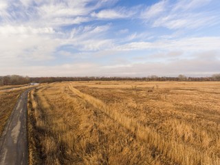 Fototapeta premium Country road in winter time. Aerial view.