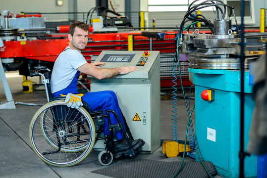 disabled worker in wheelchair in factory