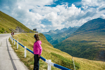 Fototapeta na wymiar Young woman enjoying the landscape in Grossglockner Hochalpenstrasse - Austria