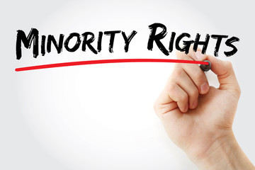 Hand writing Minority rights with marker, concept background