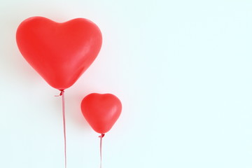 Fototapeta na wymiar Red heart shaped balloons